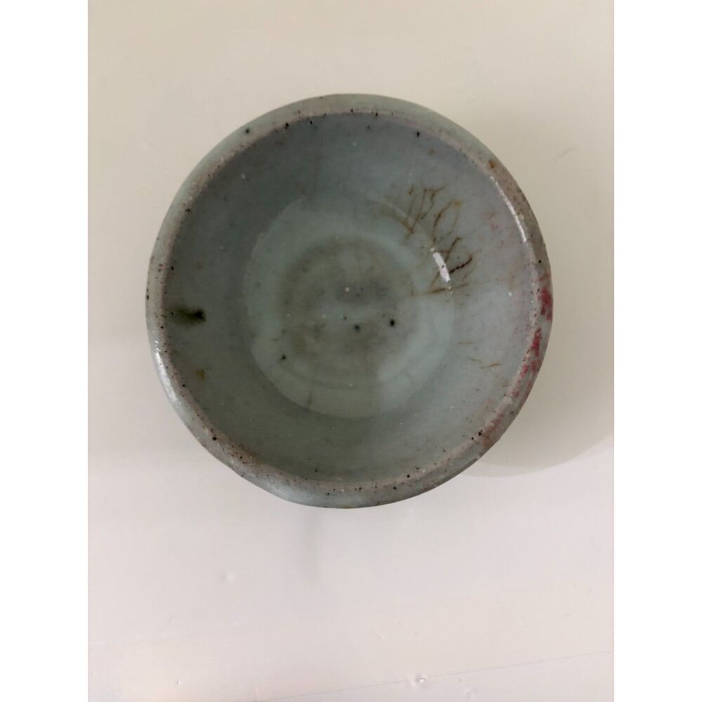 pottery bowl with clear crystal sphere and yellow cats eye heart gemstone